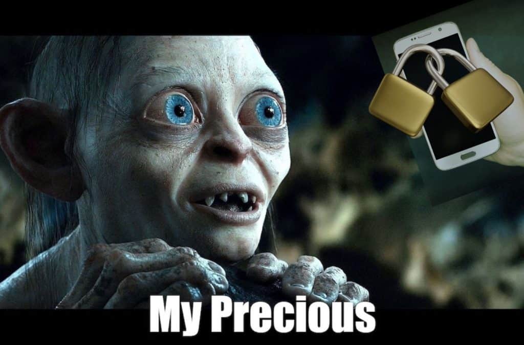 Gollum from Lord of the Rings stares lovingly at a cell phone locked away.